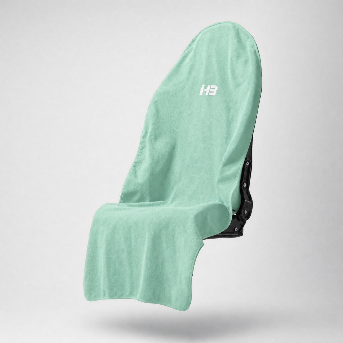 HydroBarrier waterproof seat cover in Mint Green, draped over a car seat
