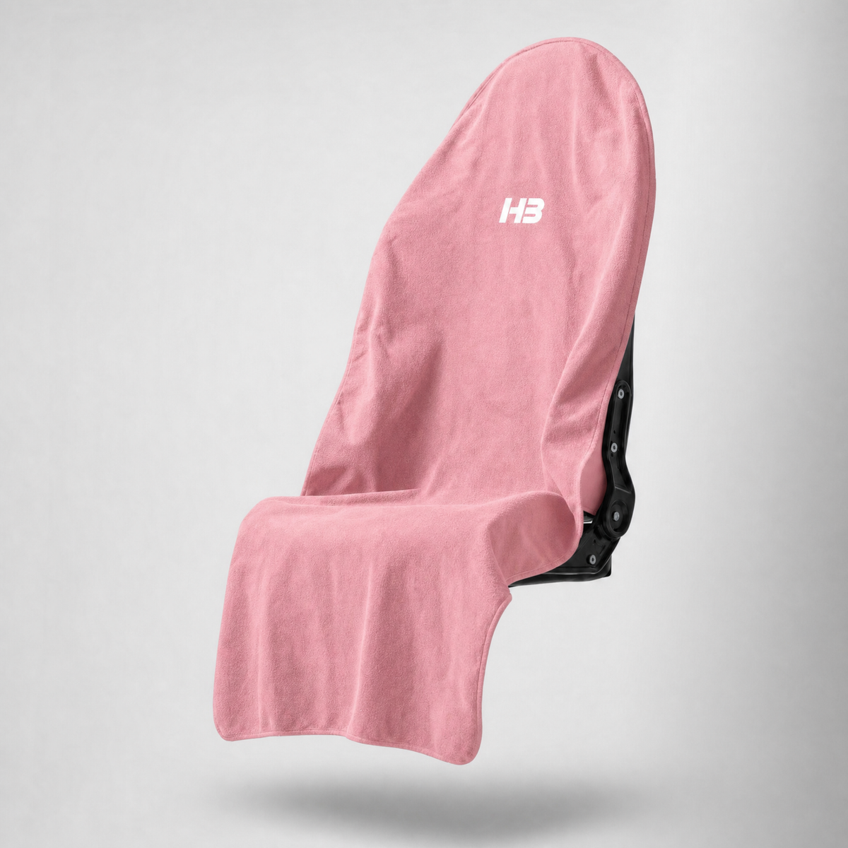 HydroBarrier waterproof seat cover in Pink, draped over a car seat