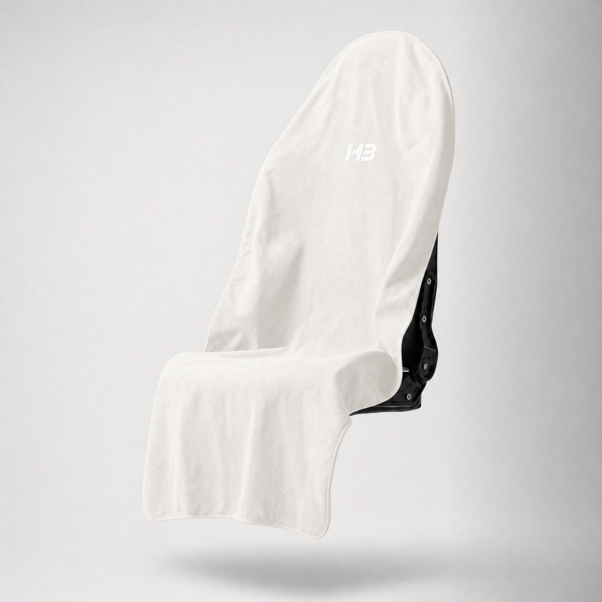 HydroBarrier waterproof seat cover in White, draped over a car seat